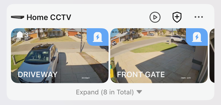 The Home CCTV group in Hik-Connect showing two cameras, each with a blue armed badge in the corner.