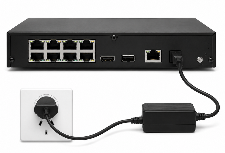The back of the NVR with the power adapter plugged into the power socket, running to a power supply and the wall.