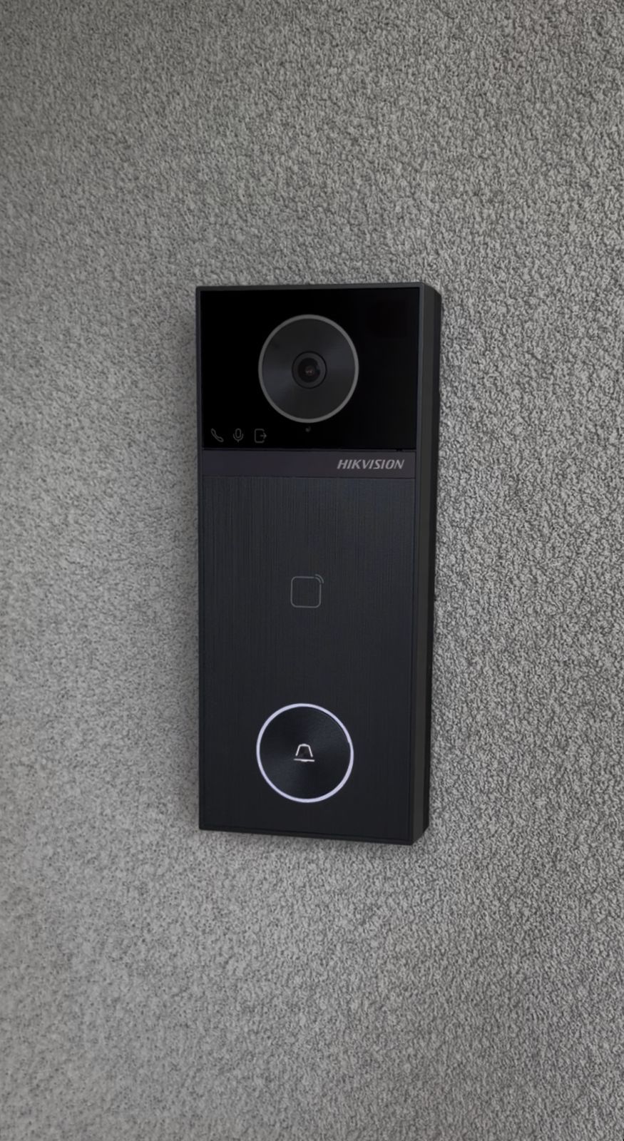 Hikvision video intercom installed on rendered wall — North Side Security